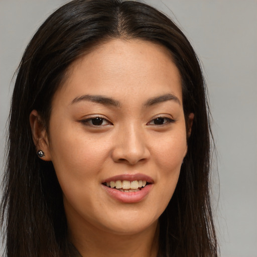 Joyful white young-adult female with long  brown hair and brown eyes