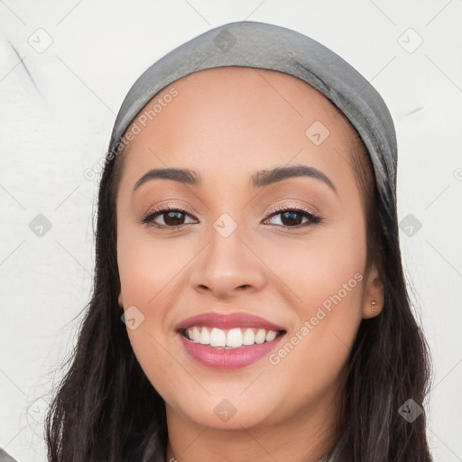 Joyful white young-adult female with long  black hair and brown eyes