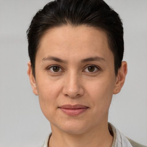 Joyful white adult female with short  brown hair and brown eyes