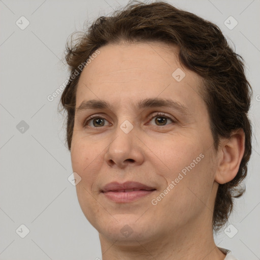 Joyful white adult female with short  brown hair and brown eyes