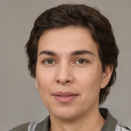 Joyful white adult female with medium  brown hair and grey eyes