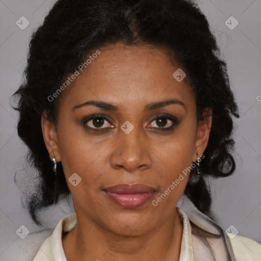 Joyful black adult female with medium  brown hair and brown eyes