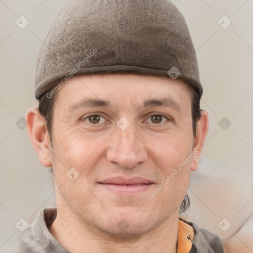 Joyful white adult male with short  brown hair and grey eyes