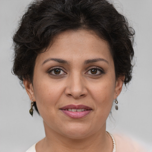 Joyful white adult female with short  brown hair and brown eyes