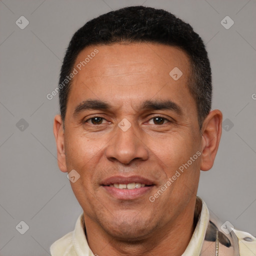Joyful latino adult male with short  brown hair and brown eyes