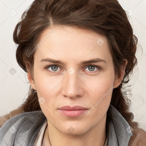 Joyful white young-adult female with medium  brown hair and blue eyes