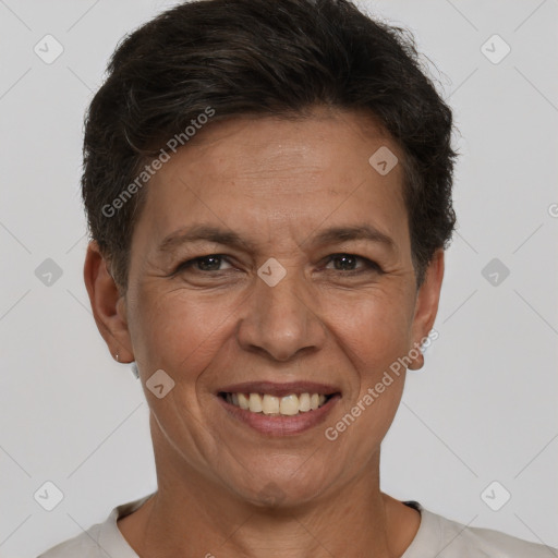 Joyful white adult female with short  brown hair and brown eyes