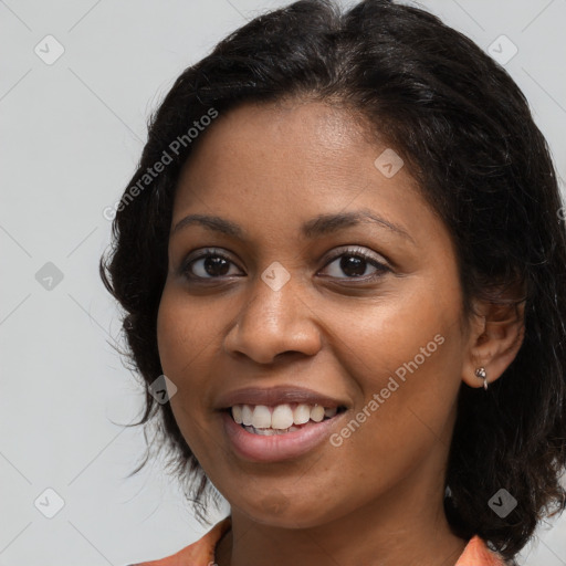 Joyful black young-adult female with medium  brown hair and brown eyes