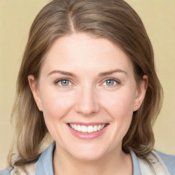 Joyful white young-adult female with medium  brown hair and blue eyes