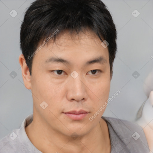 Neutral asian young-adult male with short  brown hair and brown eyes