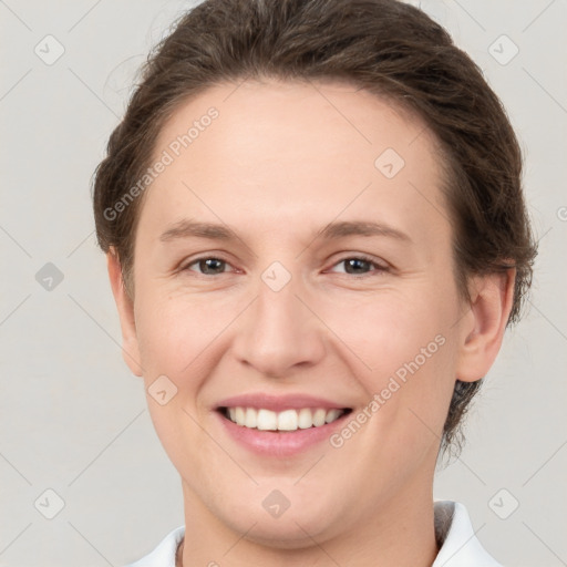 Joyful white young-adult female with short  brown hair and brown eyes