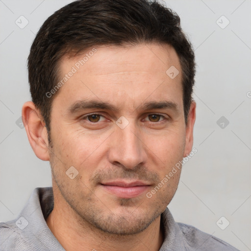 Joyful white adult male with short  brown hair and brown eyes