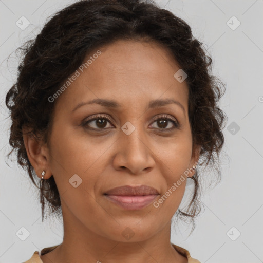 Joyful black adult female with medium  brown hair and brown eyes