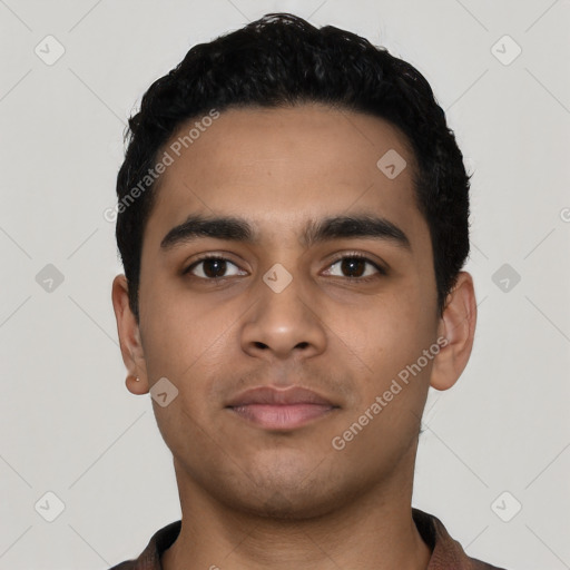 Neutral latino young-adult male with short  black hair and brown eyes