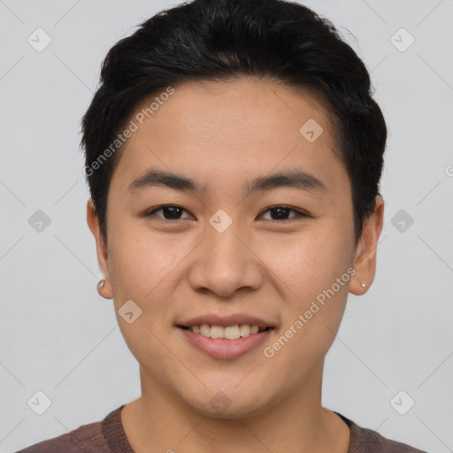 Joyful asian young-adult male with short  black hair and brown eyes