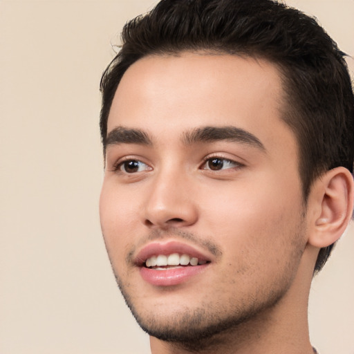 Joyful white young-adult male with short  black hair and brown eyes