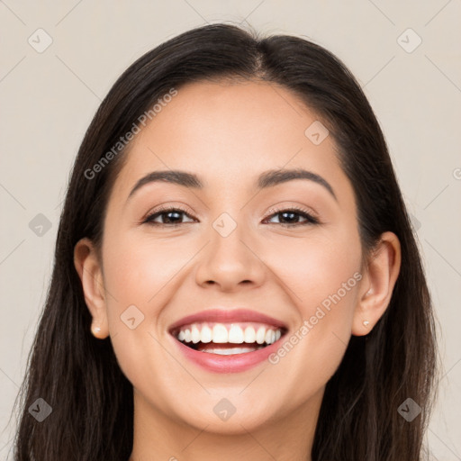 Joyful white young-adult female with long  brown hair and brown eyes