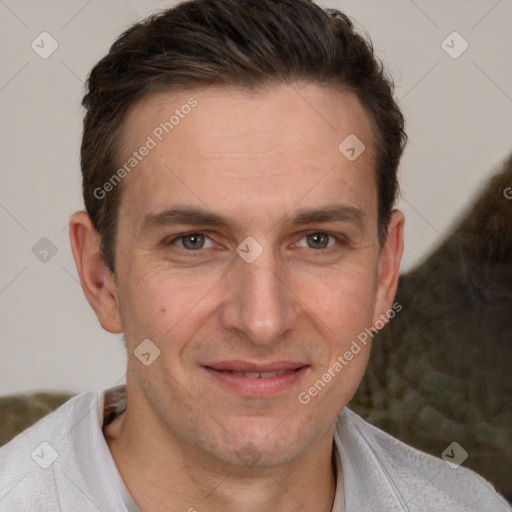 Joyful white adult male with short  brown hair and grey eyes