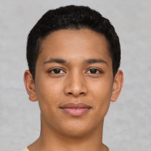 Joyful latino young-adult male with short  brown hair and brown eyes