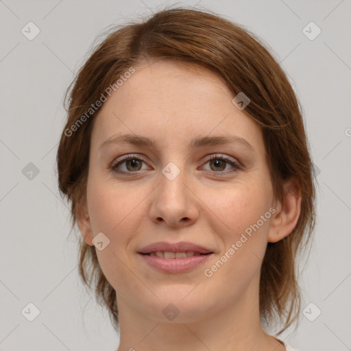 Joyful white young-adult female with medium  brown hair and green eyes