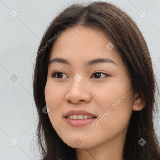 Joyful asian young-adult female with long  brown hair and brown eyes