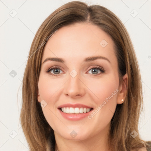 Joyful white young-adult female with long  brown hair and green eyes