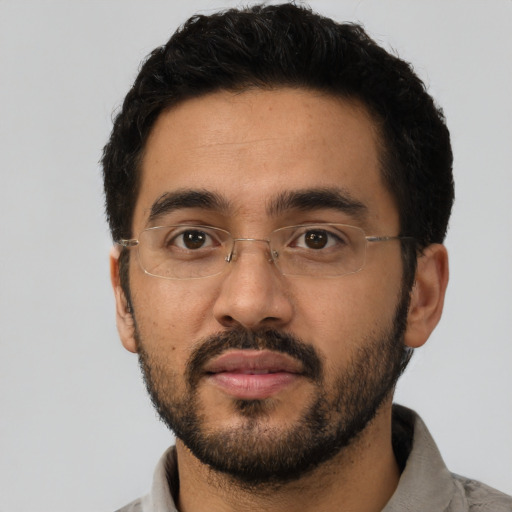 Neutral latino young-adult male with short  black hair and brown eyes
