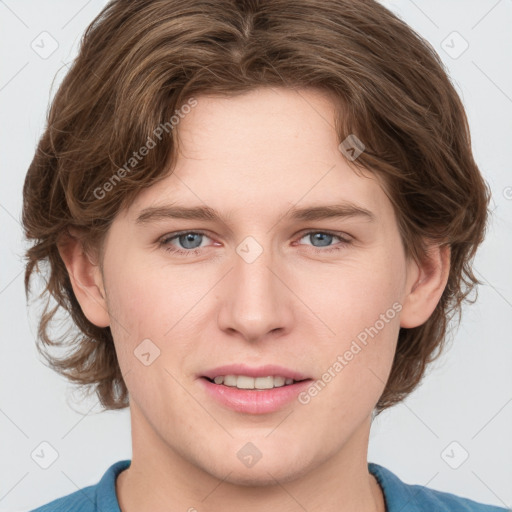 Joyful white young-adult female with medium  brown hair and blue eyes