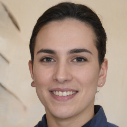 Joyful white young-adult female with medium  brown hair and brown eyes