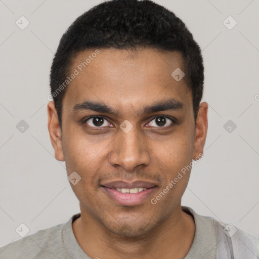 Joyful black young-adult male with short  black hair and brown eyes