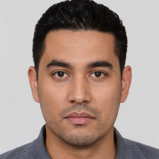 Neutral latino young-adult male with short  black hair and brown eyes