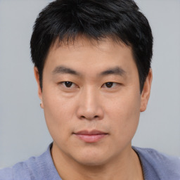 Neutral asian young-adult male with short  brown hair and brown eyes