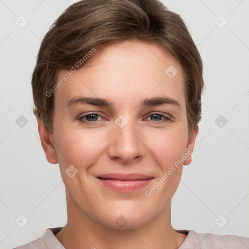 Joyful white young-adult female with short  brown hair and grey eyes