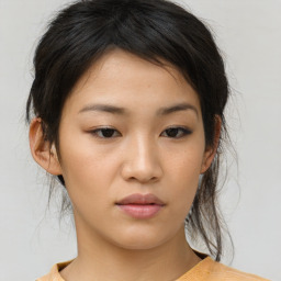 Neutral asian young-adult female with medium  brown hair and brown eyes