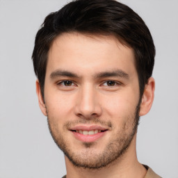 Joyful white young-adult male with short  brown hair and brown eyes