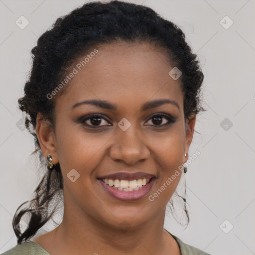 Joyful black young-adult female with long  brown hair and brown eyes