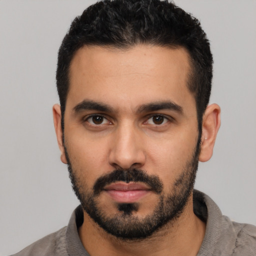 Neutral latino young-adult male with short  black hair and brown eyes