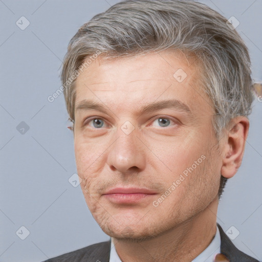 Neutral white adult male with short  brown hair and grey eyes