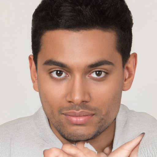 Neutral latino young-adult male with short  brown hair and brown eyes