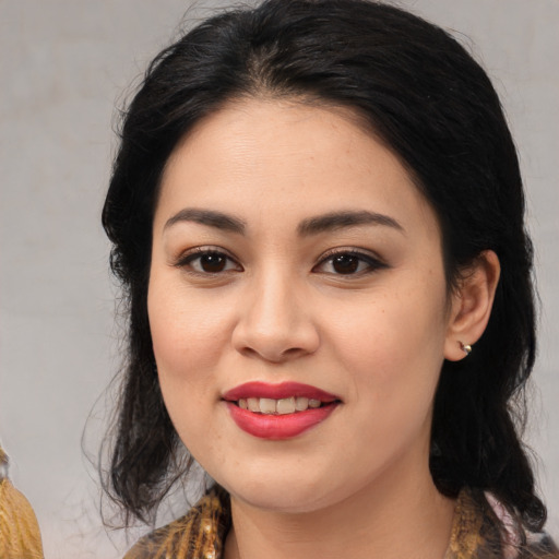 Joyful asian young-adult female with medium  brown hair and brown eyes