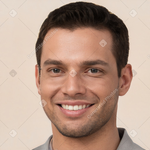 Joyful white young-adult male with short  brown hair and brown eyes