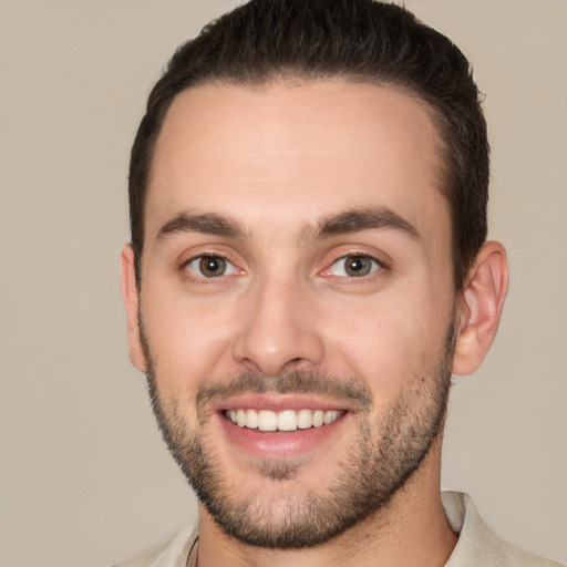 Joyful white young-adult male with short  brown hair and brown eyes