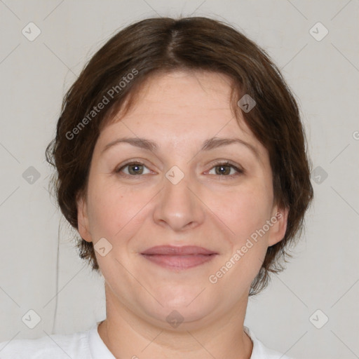 Joyful white adult female with short  brown hair and brown eyes