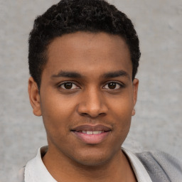 Joyful latino young-adult male with short  brown hair and brown eyes