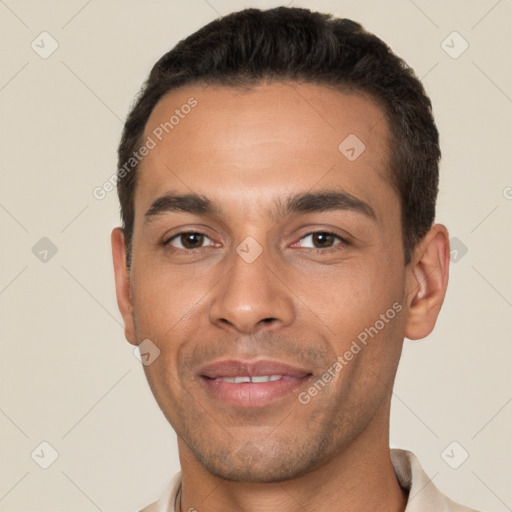 Joyful white young-adult male with short  black hair and brown eyes