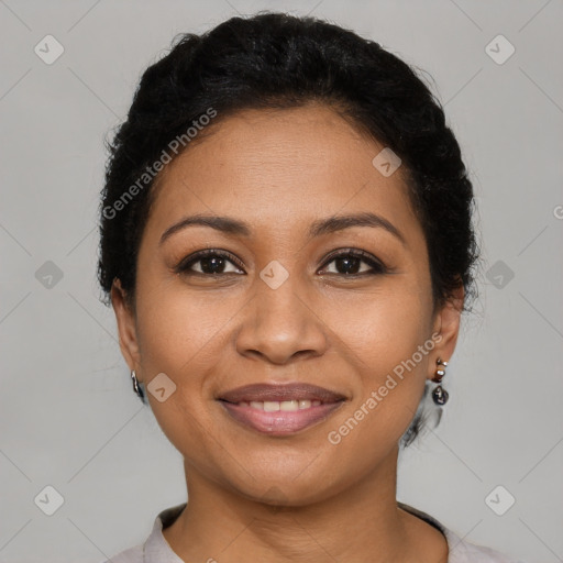 Joyful latino young-adult female with short  brown hair and brown eyes