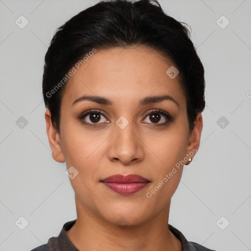 Joyful latino young-adult female with short  black hair and brown eyes