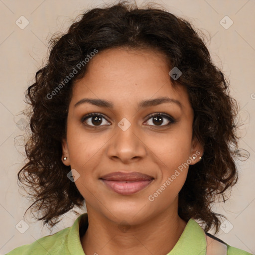 Joyful black young-adult female with medium  brown hair and brown eyes
