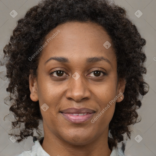 Joyful black young-adult female with medium  brown hair and brown eyes