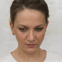 Neutral white young-adult female with short  brown hair and brown eyes